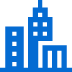Blue icon of two city buildings, one taller with a pointed roof and the other shorter with a flat roof, representing an urban home.